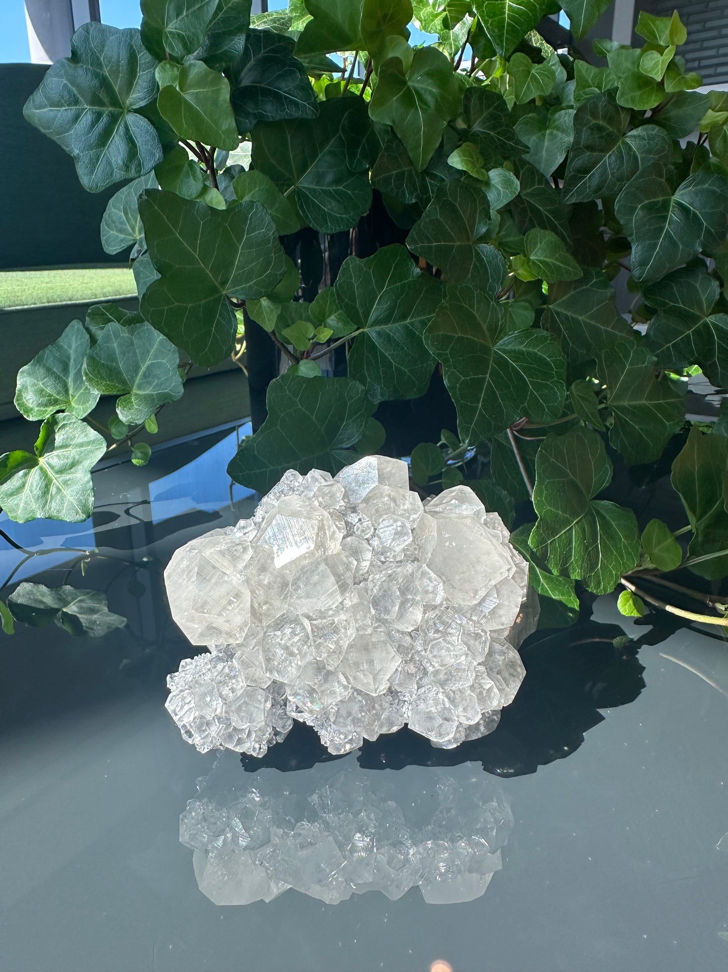 Clear Calcite Dodecahedron Cluster with Quartz Points on Hermatite